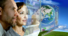 Man and Woman looking at digital screen 