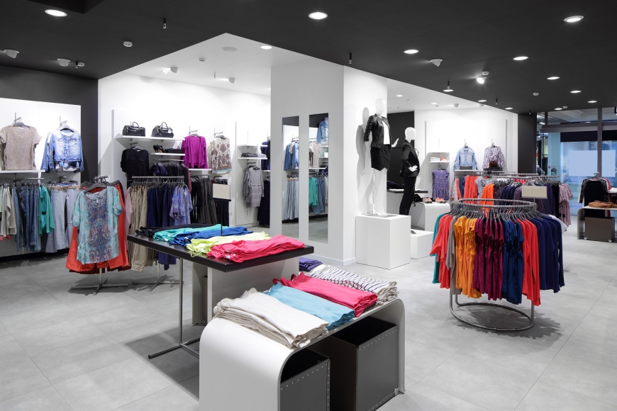 clothing tables and racks inside retail store