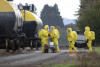 Emergency response workers in hazmat suits