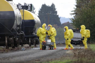 Emergency response workers in hazmat suits