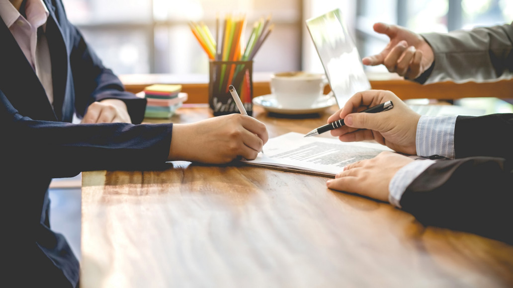 People Signing Contracts