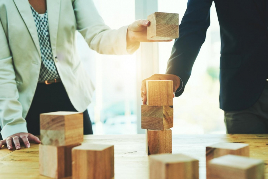 Business People Stacking Wooden Blocks