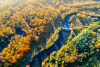 River running through woods in the fall