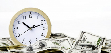 Clock in Pile of Money