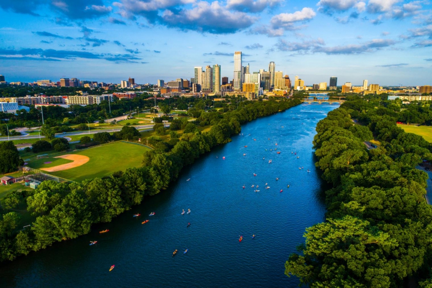 river running through a large city in the distance