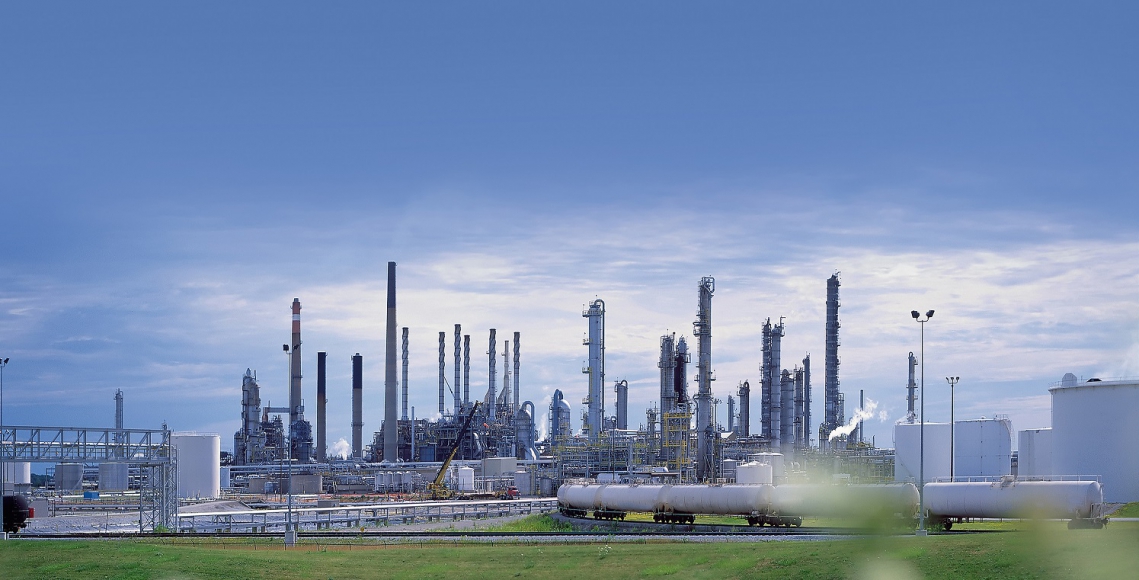 chemical plant with smoking stacks