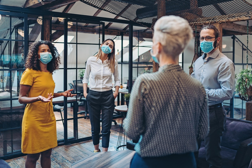Socially Distanced Coworkers wearing Masks