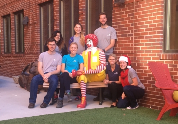 Group Sitting With Ronald McDonald Statue