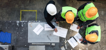 Contractors looking over plans