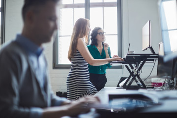 woman at standing desk proper ergonomics