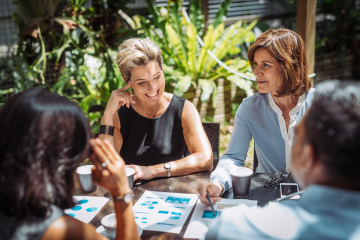 Coworkers Discussing a Plan