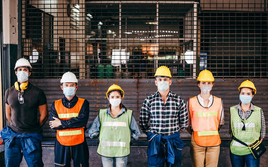Workers in line wearing PPE