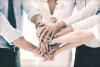 People putting their hands in