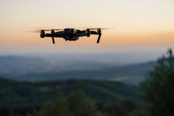 Drone flying at sunset