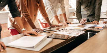 people working around a table 