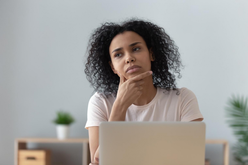 Businesswoman Weighing Decision
