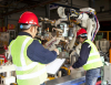 People working on robotic machine