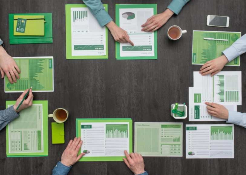 people reviewing green documents