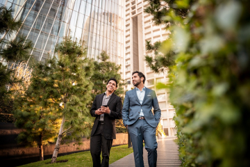 Business men walking in a park