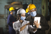 Employees wearing face masks and hard hats