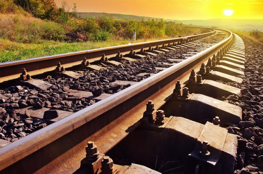 railroad tracks going into the sunset